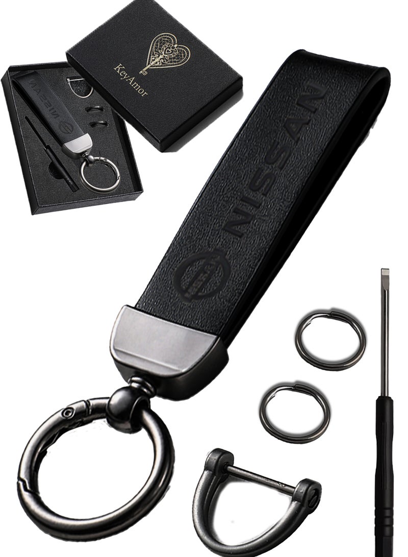 KeyAmor Luxurious Leather & Metal Keychain – Black Edition with Nissan Logo Elegant black metal and leather keychain car key holder for adults. Stylish car keychain with 3 key rings, featuring the iconic Nissan logo, perfect as a fancy gift or car accessory. Designed in a sleek black colour for a refined and modern look, it offers 360-degree rotation for added convenience, is suitable for both men and women, and comes beautifully packaged in a fancy gift box. - Image 1