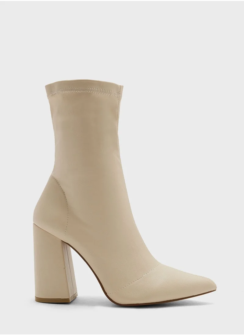 ترافل من نمشي Pointed Block Heel Sock Boot