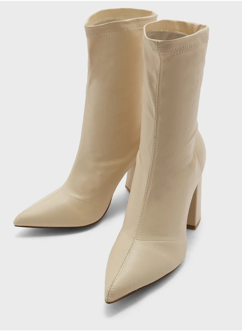 ترافل من نمشي Pointed Block Heel Sock Boot