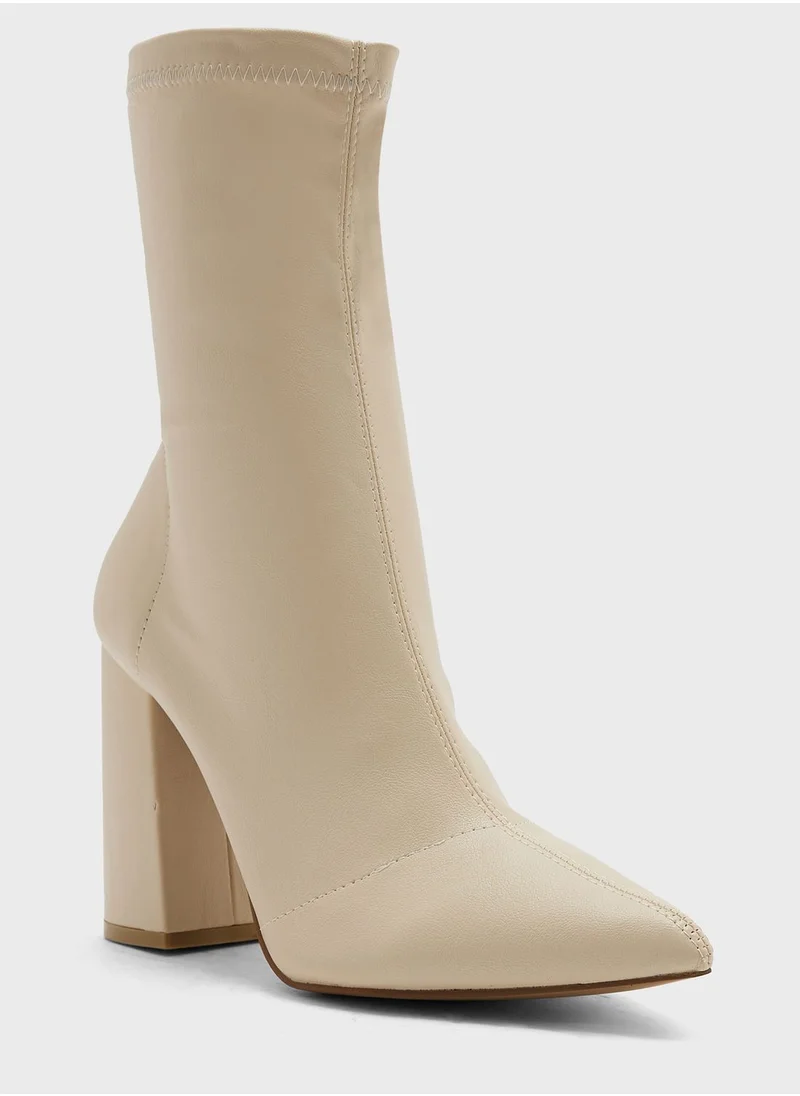 ترافل من نمشي Pointed Block Heel Sock Boot