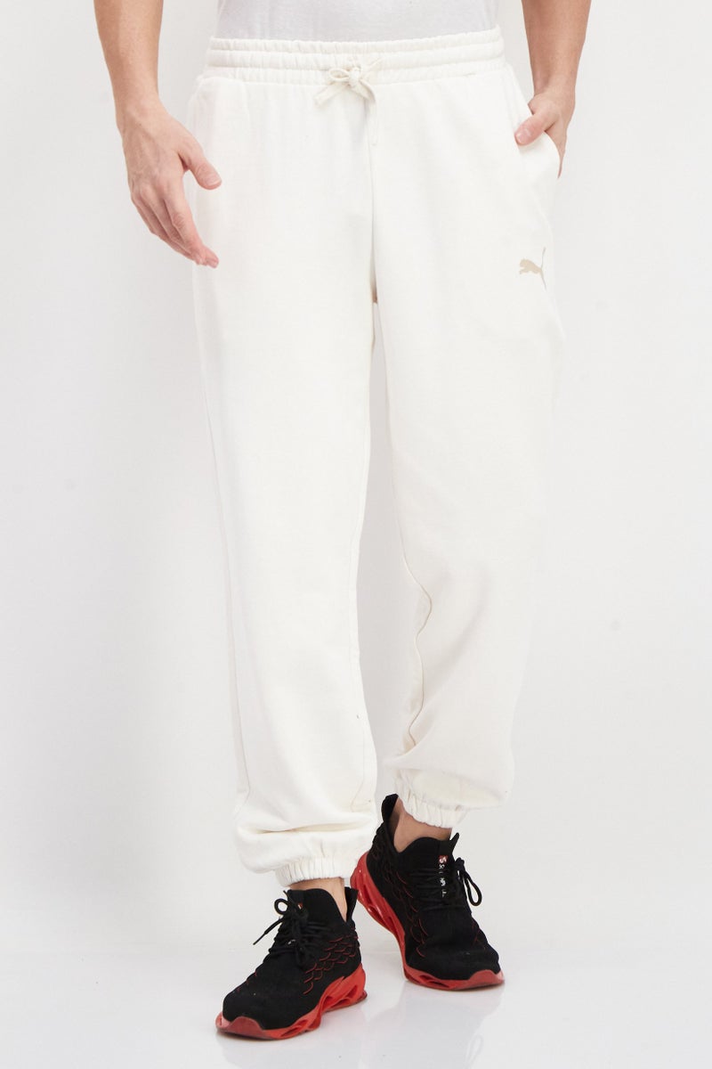 PUMA Men Sportswear Fit Brand Logo Training Sweatpants, Cream - Image 1