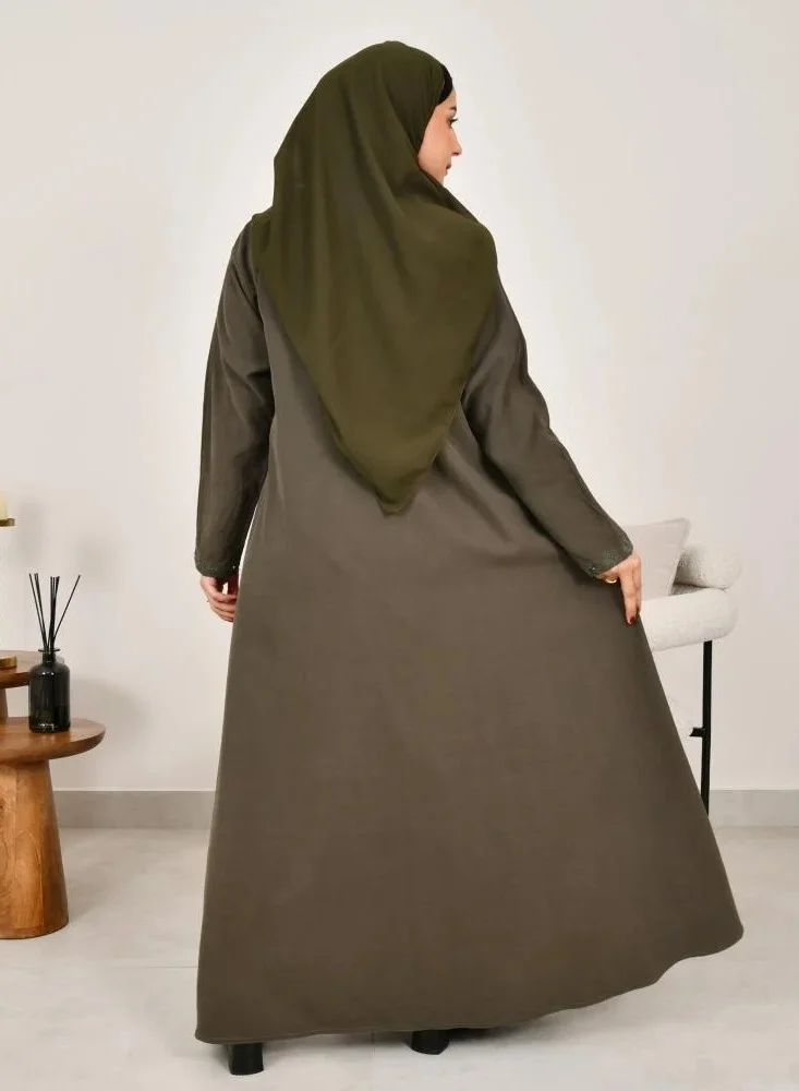 lamha abaya Elegant quarter-cloche abaya in olive green with prominent embroidery on the sides of the abaya and sleeves