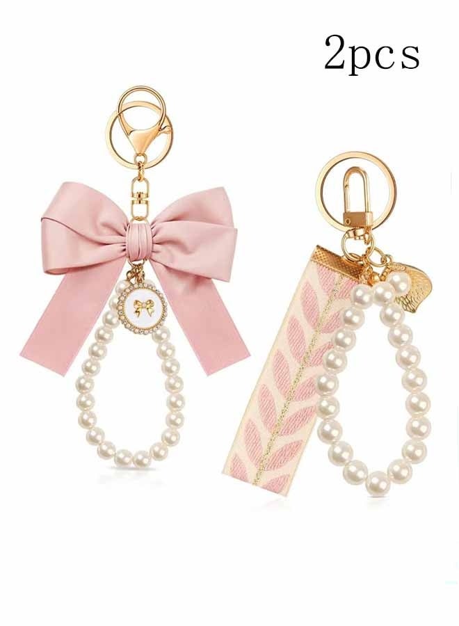 واي جيه 2 قطع من سلسلة مفاتيح ذات قوس وردي للنساء، حلقة مفاتيح معصمية باللؤلؤة، حقيبة حقيبة يدوية لمفاتيح السيارة، ملحقات حقيبة لطيفة ساحرة، حقيبة مفاتيح أنيقة للحفظ، حقيبة يد، حقيبة ظهر، هدية مثالية للفتيات (وردية فاتحة) - Image 1