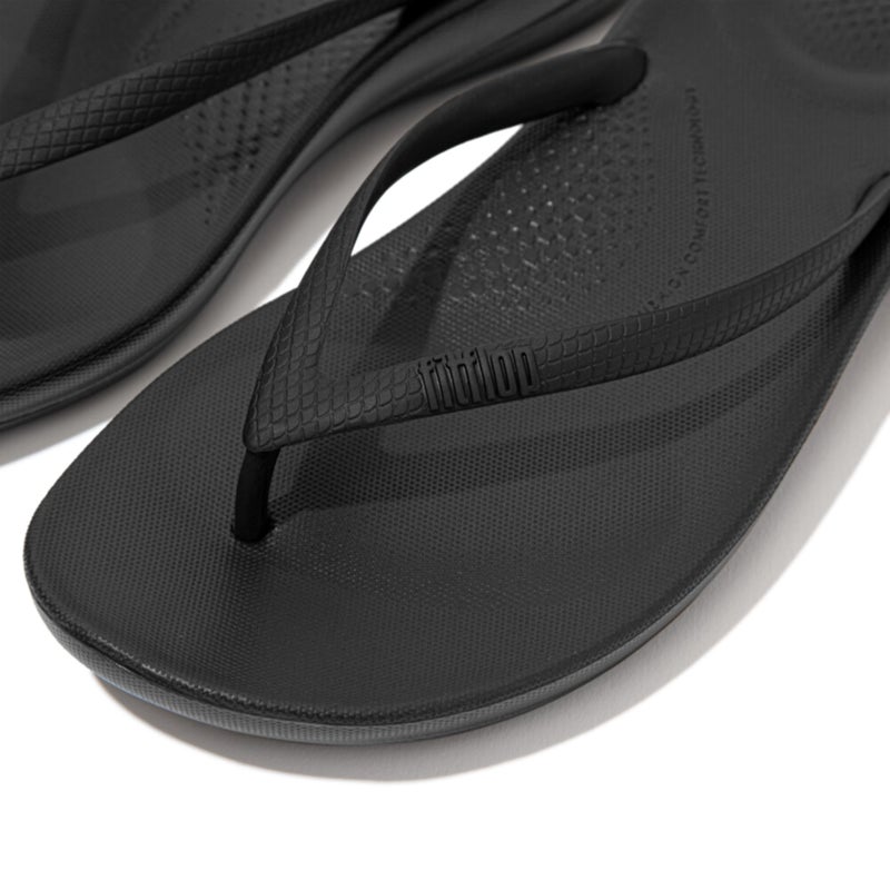 FitFlop Women's iQushion Rubber Flip-Flips with Contoured Footbed for Walking, Lightweight Ergonomic Flip Flop Sandals with Arch Support and Foot Impact Pillows, All Black, 9 US Women - Image 2