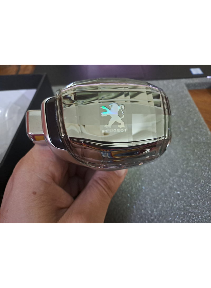 Crystal handle with side button and Peugeot logo, specializing in all types of manual cars. - Image 1