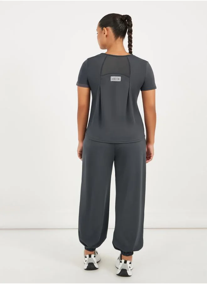 ستايلي Gymspire Edition - Label Text Print Mesh Insert Short Sleeve Top