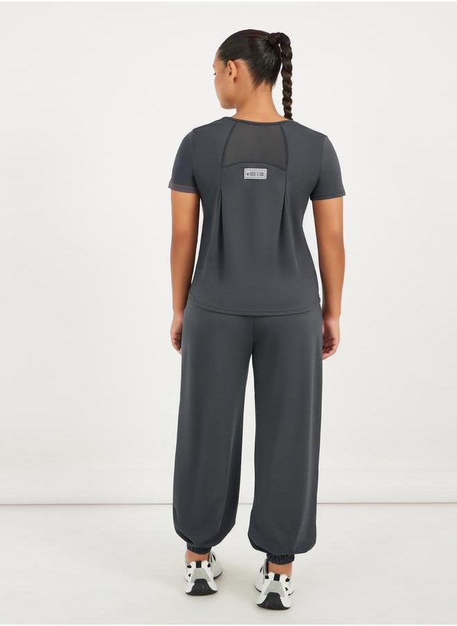 Styli - Gymspire Edition - Label Text Print Mesh Insert Short Sleeve Top - Image 1
