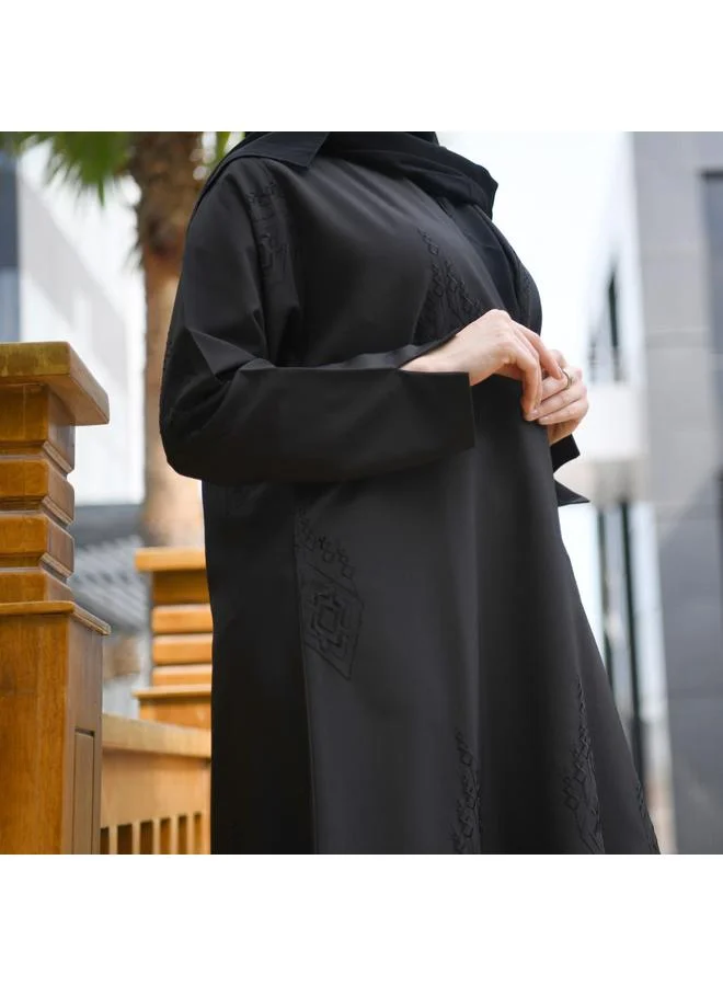 HAWRAA ABAYA Elegant black wrap abaya with matte black embroidery all over the abaya and a pleat at the back