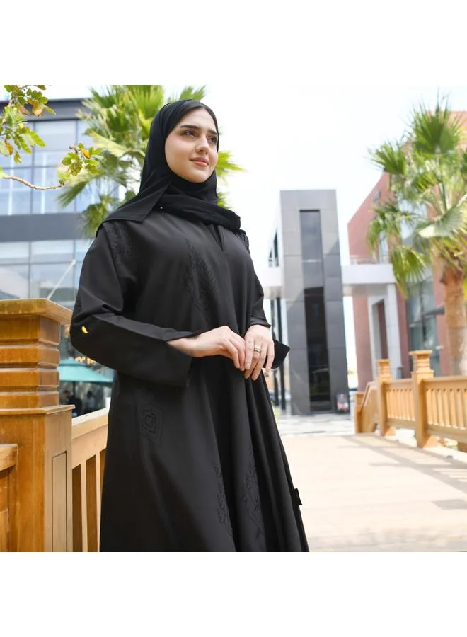 HAWRAA ABAYA Elegant black wrap abaya with matte black embroidery all over the abaya and a pleat at the back