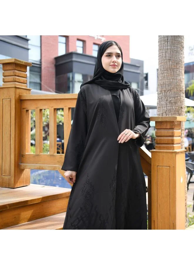 HAWRAA ABAYA Elegant black wrap abaya with matte black embroidery all over the abaya and a pleat at the back