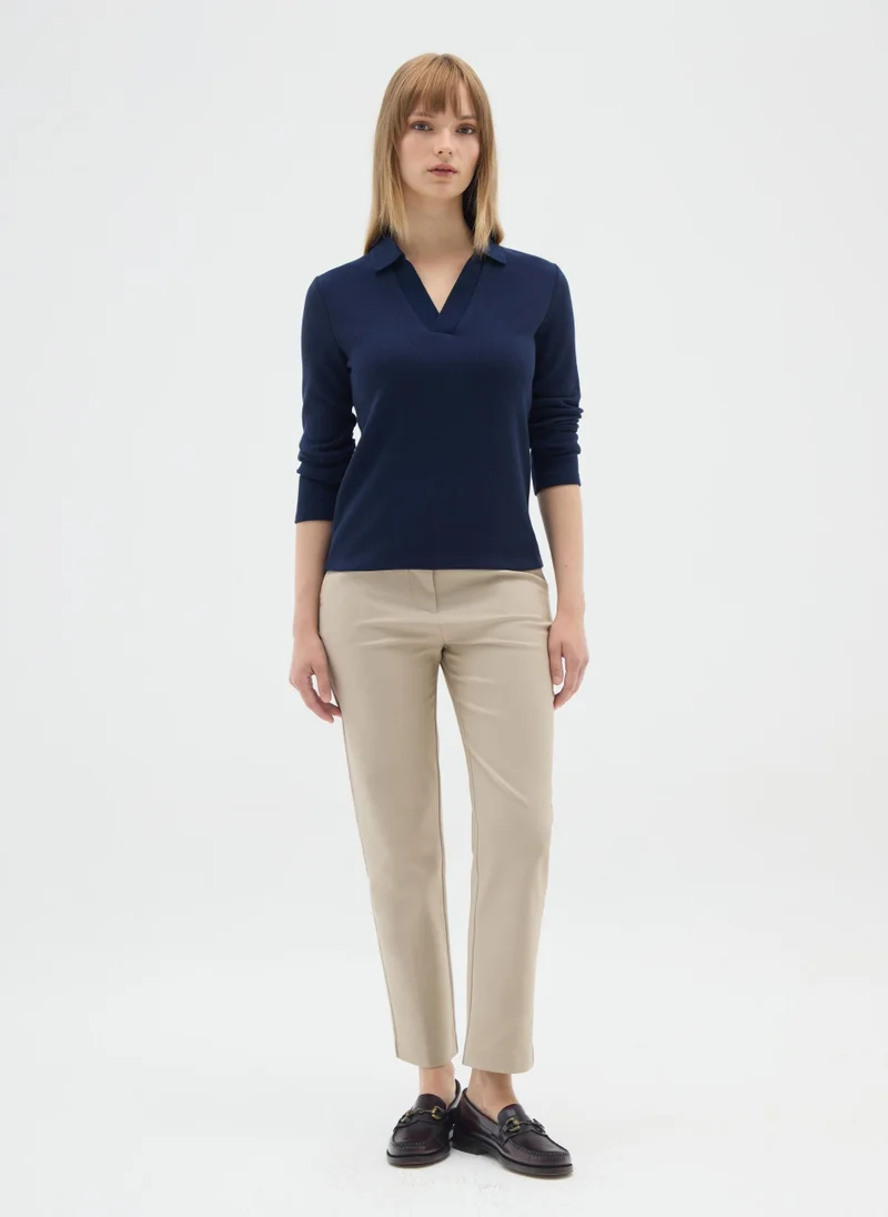 او في اس بولو أوفيس أزرق بأكمام طويلة وقماش مطاطي