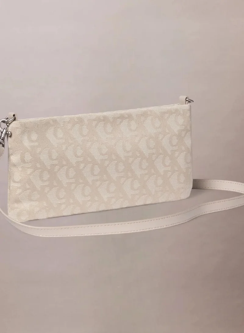 Calvin Klein Jeans NATURAL AOP Monogram Mini Crossbody Bag for Women | Best Price UAE