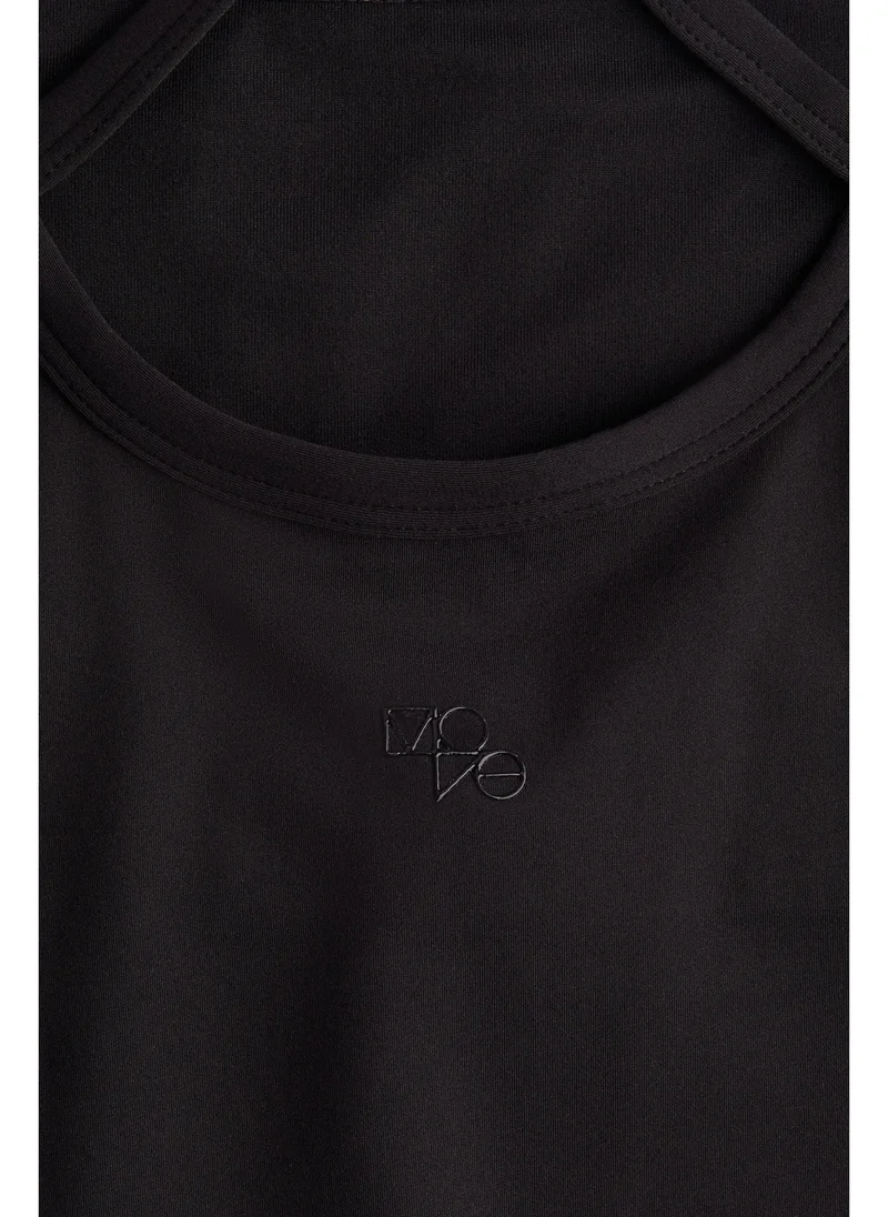H&M Integral-bra sports strappy top with SoftMove™