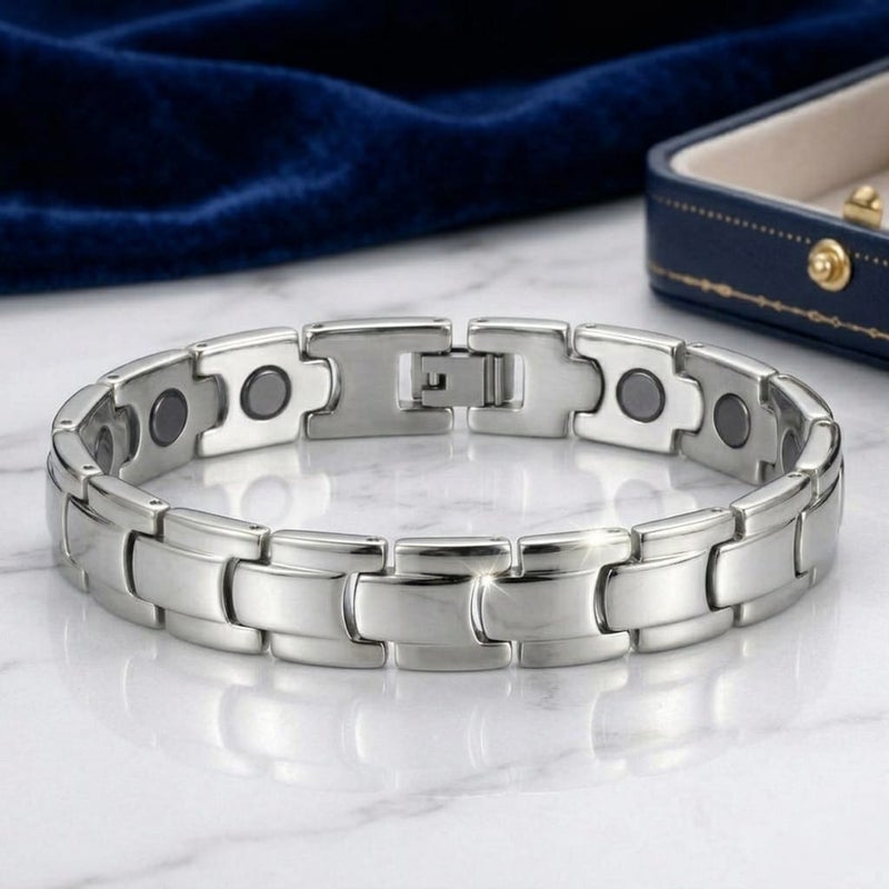 A luxurious men's bracelet crafted from rust-resistant stainless steel, featuring a geometric ring design in a lustrous silver finish. It incorporates internal magnetic elements for added allure. - Image 4