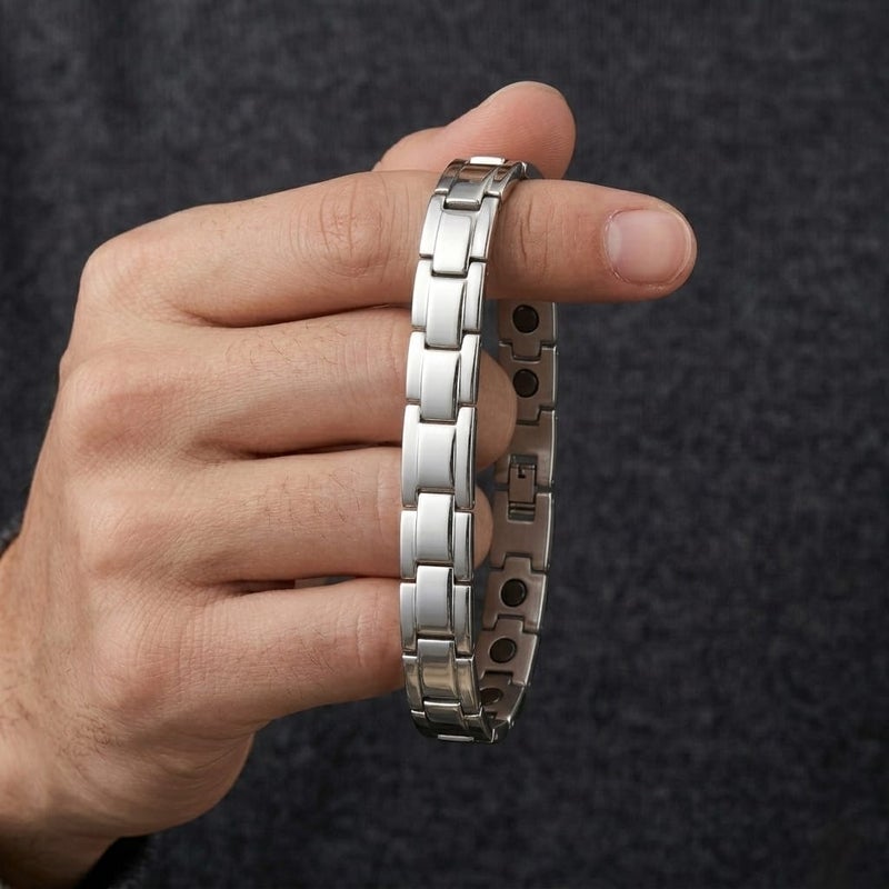 A luxurious men's bracelet crafted from rust-resistant stainless steel, featuring a geometric ring design in a lustrous silver finish. It incorporates internal magnetic elements for added allure. - Image 5