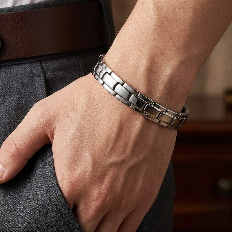 A luxurious men's bracelet crafted from rust-resistant stainless steel, featuring a geometric ring design in a lustrous silver finish. It incorporates internal magnetic elements for added allure. - Image 2