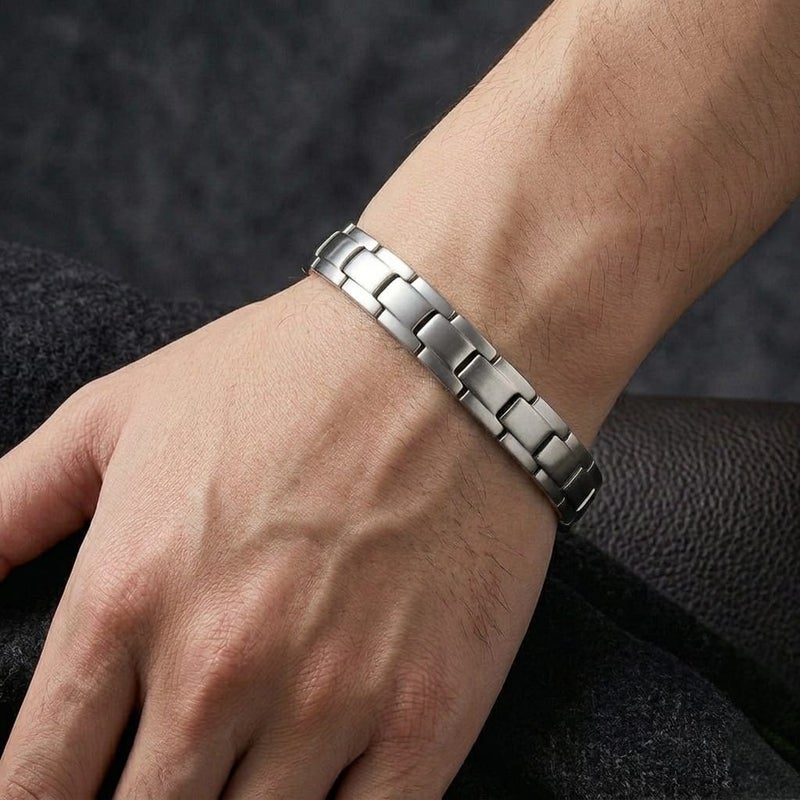 A luxurious men's bracelet crafted from rust-resistant stainless steel, featuring a geometric ring design in a lustrous silver finish. It incorporates internal magnetic elements for added allure. - Image 3