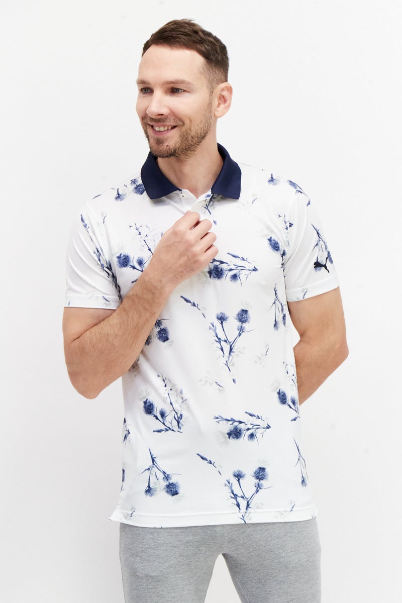 PUMA قمصان بولو رياضية للرجال بنقشة زهور، باللون الأبيض/الأزرق الداكن - Image 1