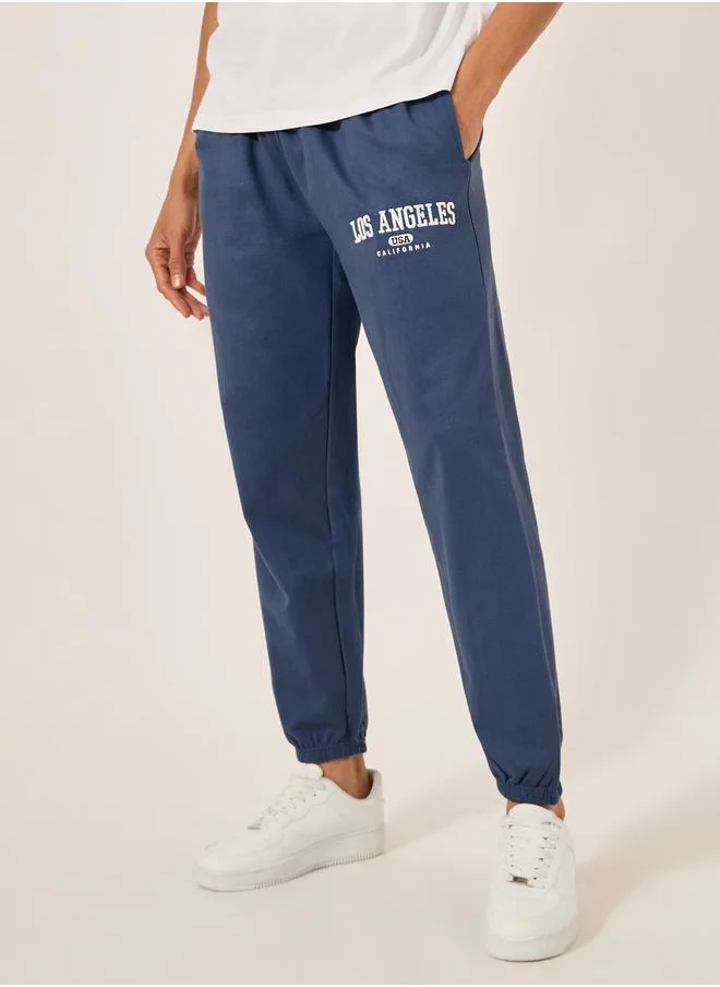 Styli Embroidered Slogan Mid Rise Relaxed Fit Joggers