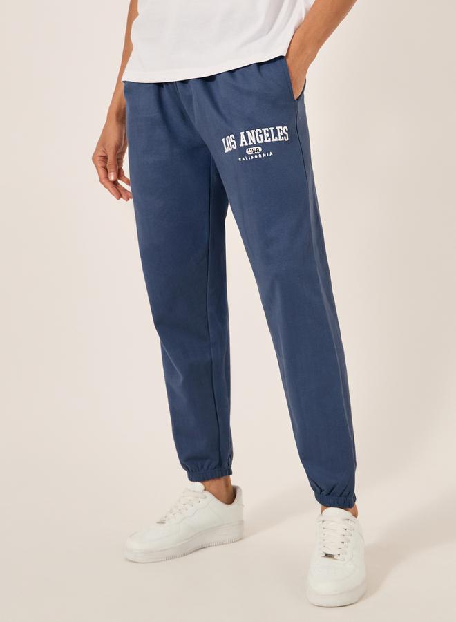 Styli Embroidered Slogan Mid Rise Relaxed Fit Joggers  - Image 1