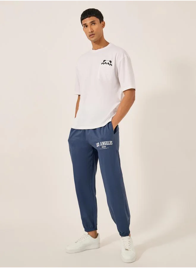 Styli Embroidered Slogan Mid Rise Relaxed Fit Joggers