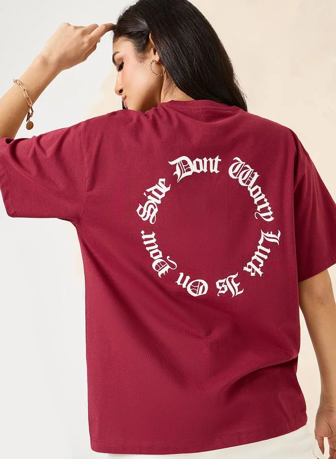Styli Oversized Round Neck Slogan Longline T-Shirt