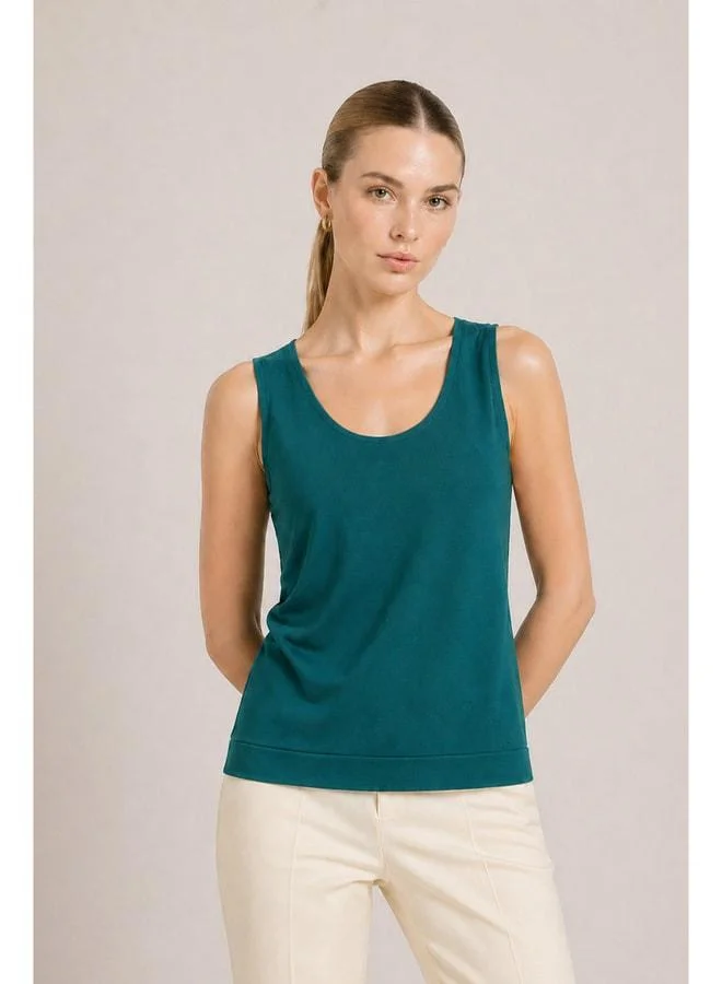 مصرلو 1951 قميص بلا أكمام أساسي للنساء باللون الفيروزي الداكن.