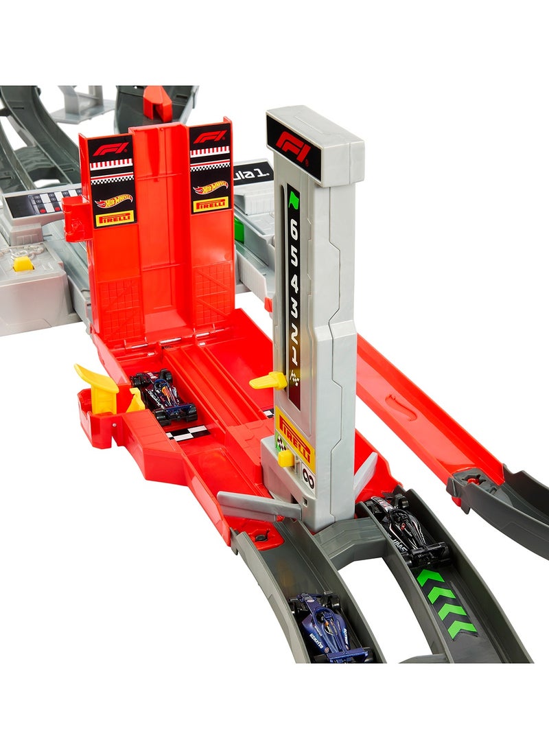 Hot Wheels Toy Car Track Set, Formula 1® Grand Prix Circuit Track Set with 3 1:64 Scale Die-Cast Toy Cars, Two Modes of Racing with a Motorized Booster - Image 4