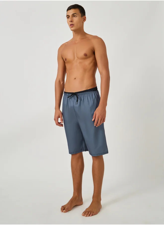 ستايلي Styli Solid Regular Fit Swim Shorts with Contrast Waistband