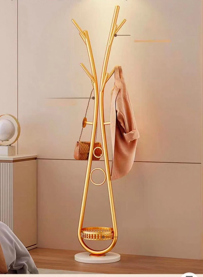 شي ون علاقة ملابس مودرن بتصميم نحتي فاخر من SHEE ONE | حامل معاطف معدني مقاوم للصدأ مع خطافات متعددة | قاعدة دائرية ثابتة وتخزين سفلي ذكي | مناسب للمداخل والغرف الصغيرة | متوفر بعدة ألوان أنيقة | 172×30×30 سم | لون ذهبي - Image 1