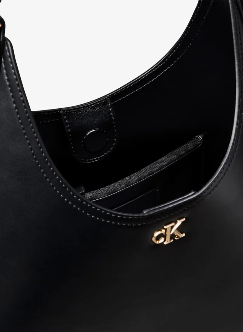 Calvin Klein  Monogram Hardware Curved Shoulder Bag for Women | Best Price UAE