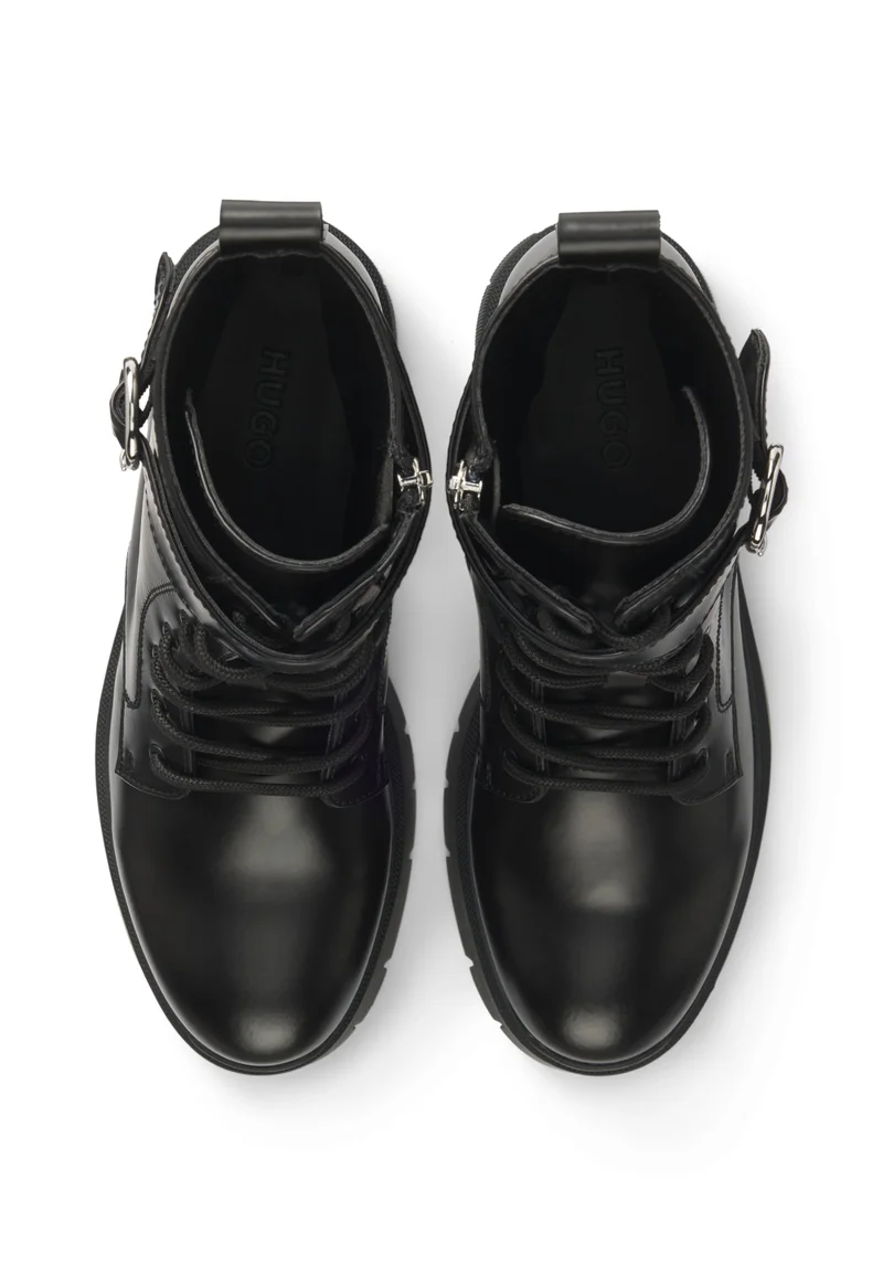 هوجو Faux-leather boots with buckled strap
