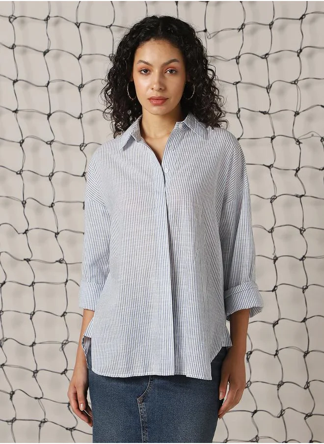 Hubberholme Women Shirts in Blue featuring Oversized fit with a strip pattern, spread collar collar, collar neckline, full sleeve, secured with button closure, crafted from 100% cotton – perfect for elevating your everyday style.