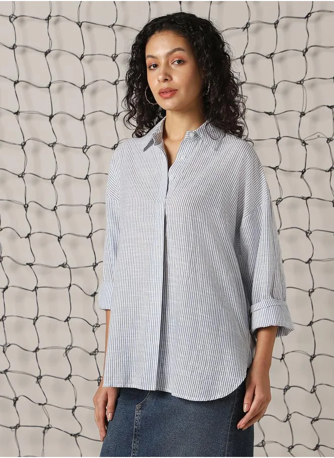 Hubberholme Women Shirts in Blue featuring Oversized fit with a strip pattern, spread collar collar, collar neckline, full sleeve, secured with button closure, crafted from 100% cotton – perfect for elevating your everyday style.