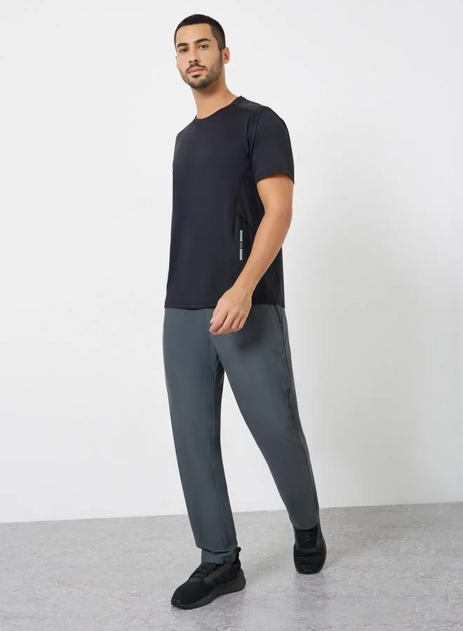 Styli Active Men Relaxed Track Pant with Side Print and Zipper Detail