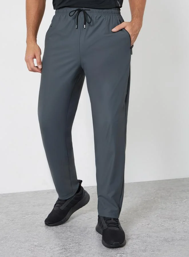 Styli Active Men Relaxed Track Pant with Side Print and Zipper Detail
