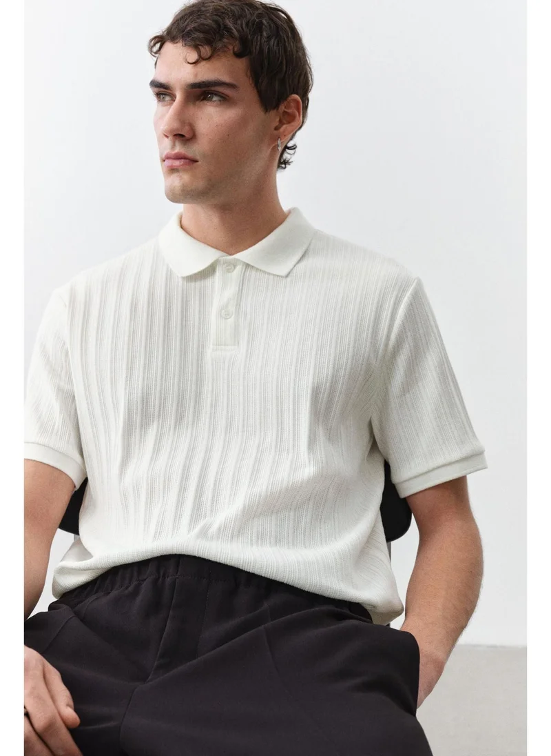 اتش اند ام Slim Fit Textured jersey polo shirt