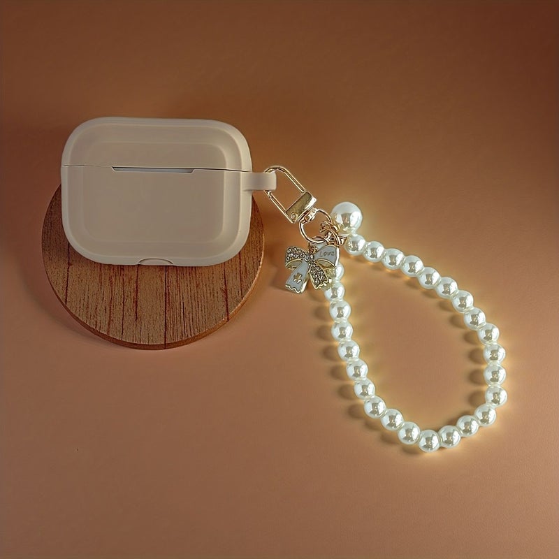 حافظة خفيفة باللون البني الفاتح لـ AirPods 4 مع سلسلة مفاتيح ناعمة مقاومة للصدمات مزينة بقلادة قوس لؤلؤي - Image 5
