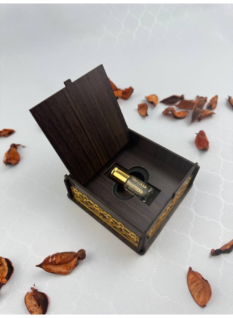 Samrix Abeer Box: A luxurious wooden box adorned with acrylic decorations on the sides, containing a quarter tola of oud oil.  ✔ Abeer Box: A luxurious box with an elegant wooden design.  ✔ Decorated with distinctive acrylic decorations.  ✔ Contains a quarter tola of oud oil.  ✔ Suitable for luxury gifts and giveaways. ✔ Reflects refined taste and Arabian luxury. ✔ An ideal gift for friends and family. ✔ Suitable for weddings and engagements. ✔ Perfect for high-end corporate gifts. ✔ Luxurious packaging, ready for presentation. ✔ High-quality materials for durability. ✔ A long-lasting and luxurious oud fragrance. ✔ A practical yet elegant design. ✔ Adds a touch of luxury to any occasion. ✔ Reflects authenticity and Arabian heritage. ✔ Suitable for religious and formal occasions. ✔ Makes the gift more valuable and distinctive. ✔ A sophisticated gift that combines beauty and fragrance. ✔ A luxurious work of art for display and use. - Image 2
