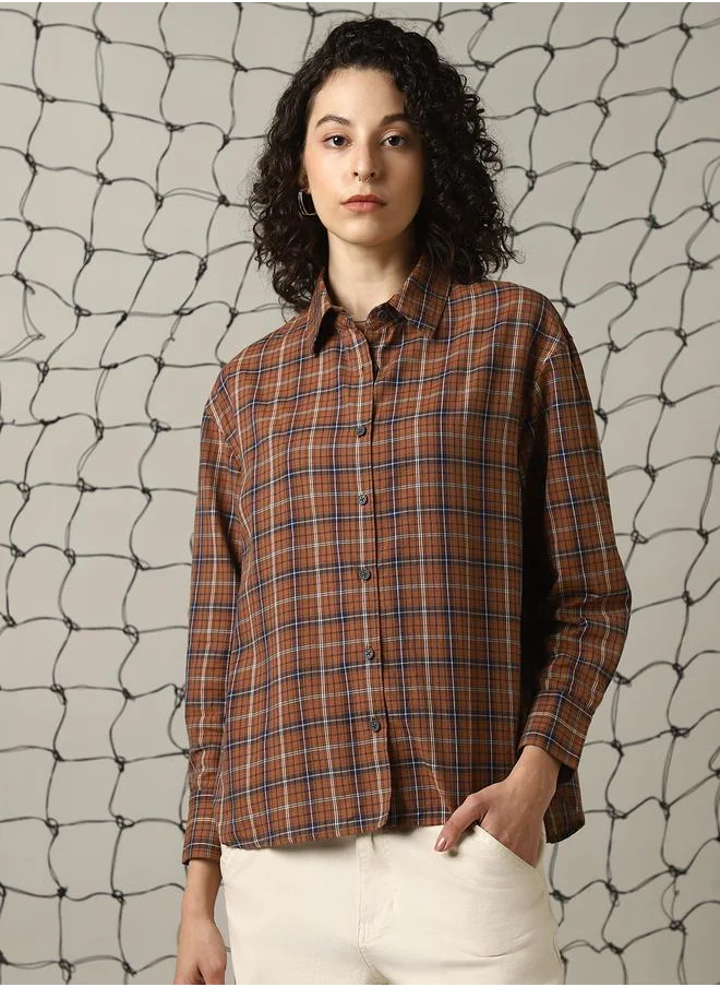 Hubberholme Women Shirts in Brown featuring Oversized fit with a check pattern, spread collar collar, collar neckline, full sleeve, secured with button closure, crafted from 100% cotton – a trendsetting piece that blends fashion and comfort.