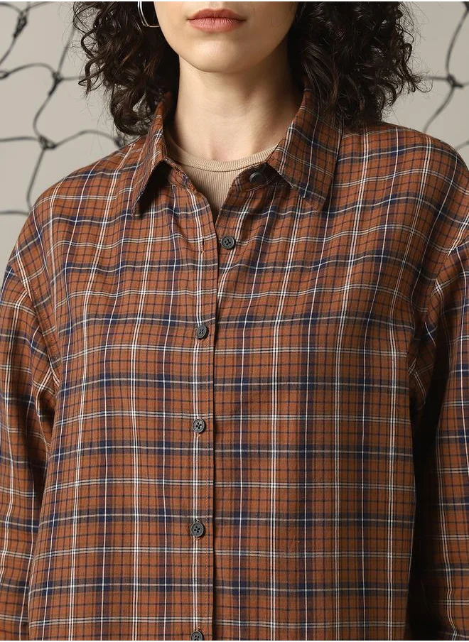 Hubberholme Women Shirts in Brown featuring Oversized fit with a check pattern, spread collar collar, collar neckline, full sleeve, secured with button closure, crafted from 100% cotton – a trendsetting piece that blends fashion and comfort.