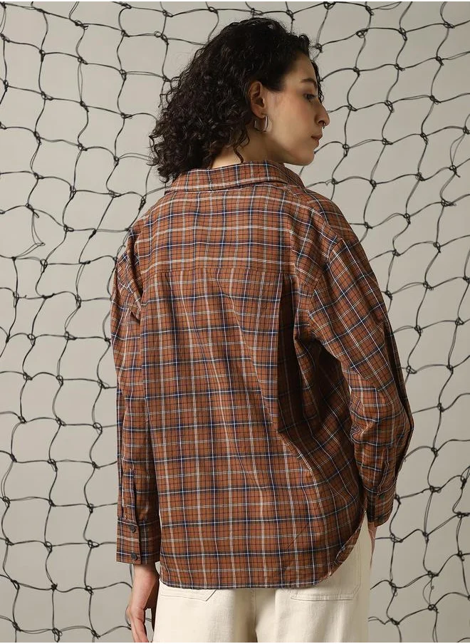 Hubberholme Women Shirts in Brown featuring Oversized fit with a check pattern, spread collar collar, collar neckline, full sleeve, secured with button closure, crafted from 100% cotton – a trendsetting piece that blends fashion and comfort.