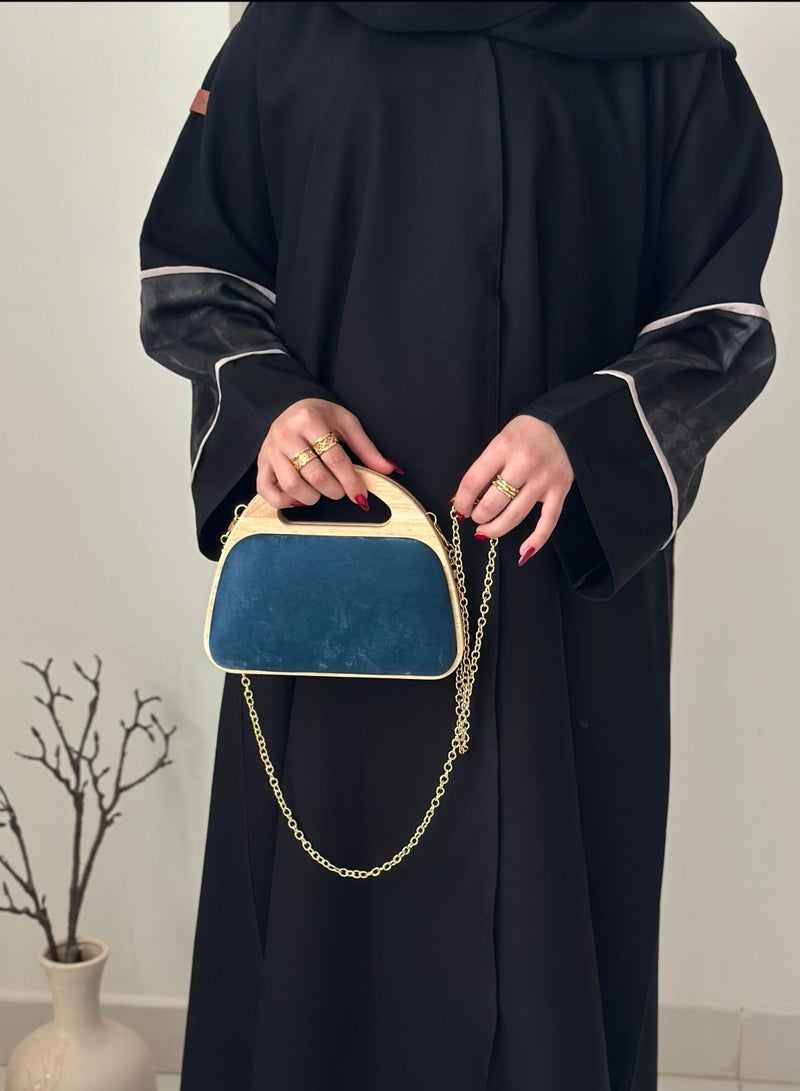 A handbag with a distinctive design with a wooden frame - Image 1