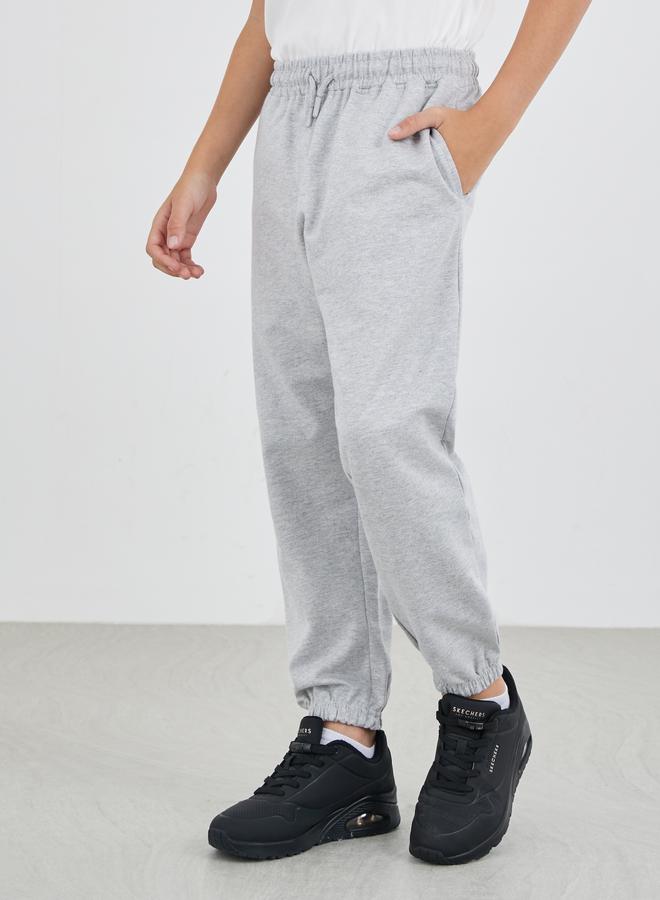 ستايلي بنطلون رياضي رمادي سادة بأساور وجيوب جانبية - Image 1