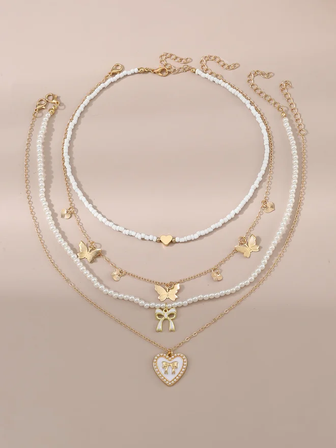 Take Two Take Two Set of 4 - Bow Pendant Faux Pearl Necklace