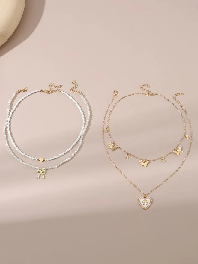 Take Two Take Two Set of 4 - Bow Pendant Faux Pearl Necklace