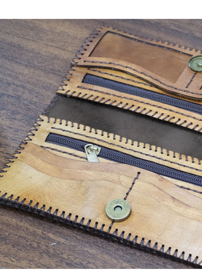 ✨ Handmade Genuine Leather Wallet – Timeless Elegance & Function 100% genuine leather – handcrafted Artistic laser engraving Magnetic clasp 8 card slots 2 zippered pockets + 2 additional compartments Size: 9×20 cm 🛒 Available now on Noon  From Holy of Holies Store – where style meets craftsmanship  - Image 2