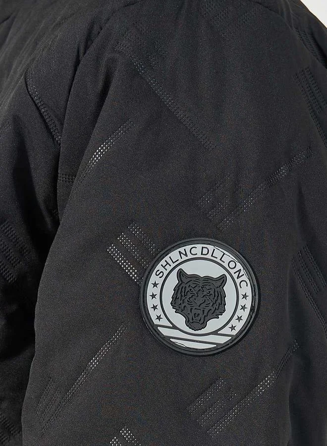 Styli Chevron Quilted Puffer Jacket with Faux Fur Lining & Badge Detail