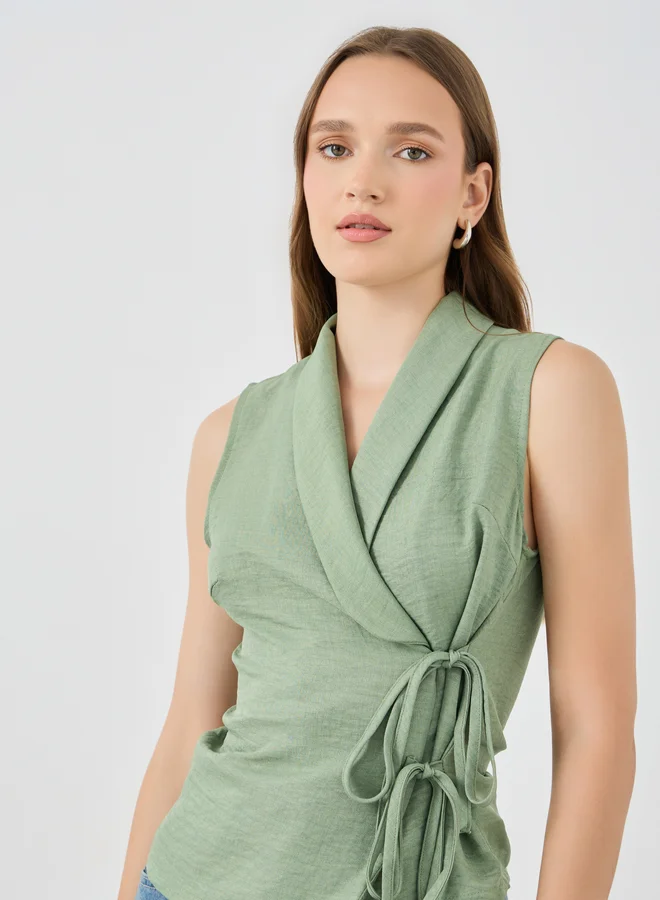 Styli Styli Solid Sleeveless Wrap Top with Tie-Up Detail