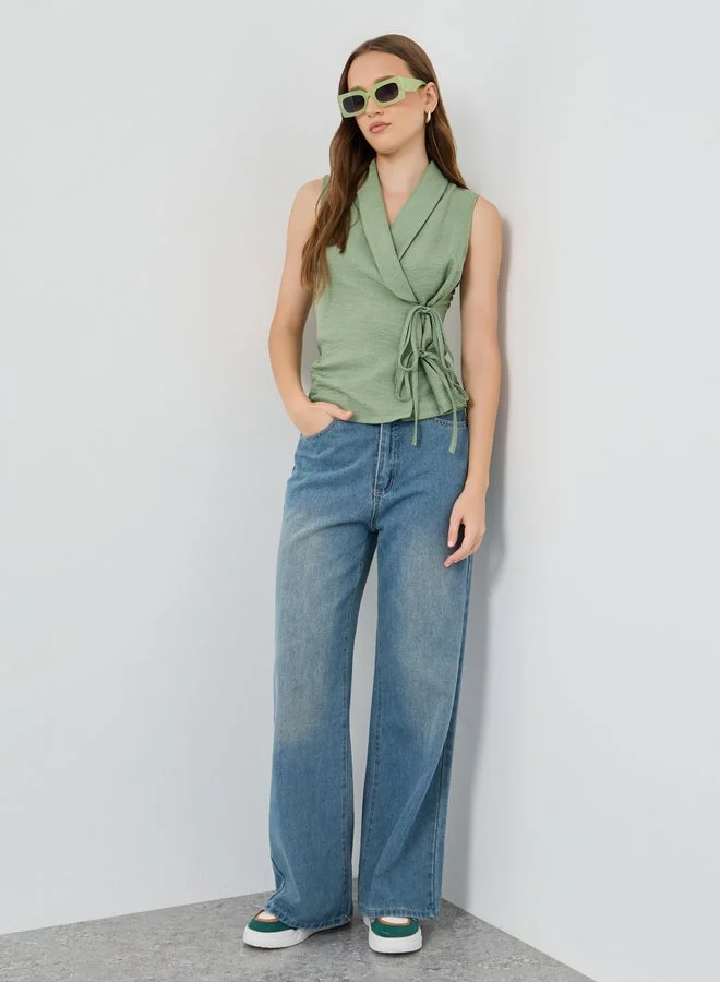 Styli Solid Sleeveless Wrap Top with Tie-Up Detail